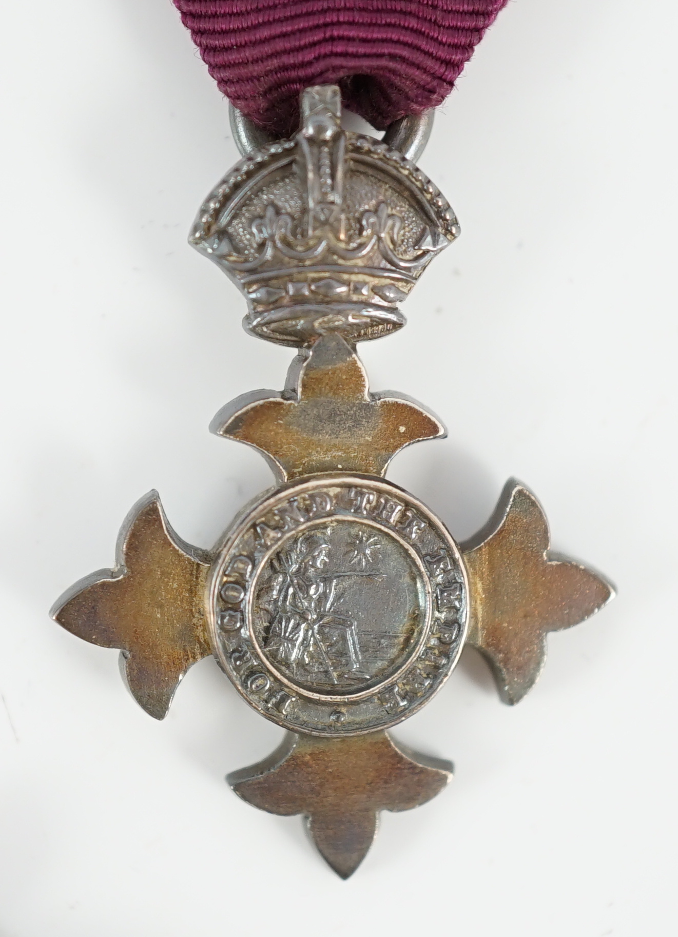 A cased George V military MBE containing leaflet with instructions as to wearing Insignia, together with the separately cased miniature